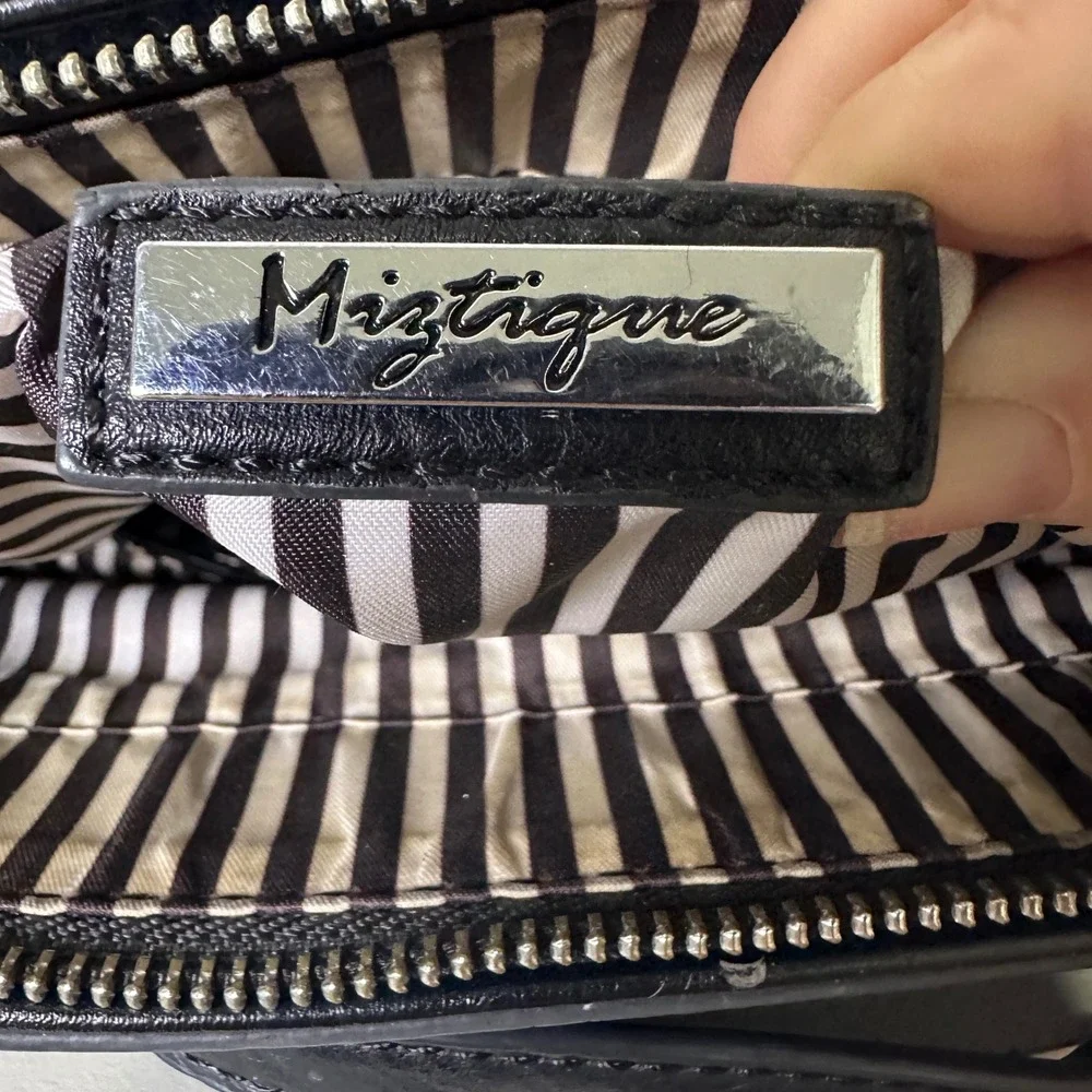 Miztique Black non Leather Crossbody Bag Tassel Zipper Accents Striped Lining
